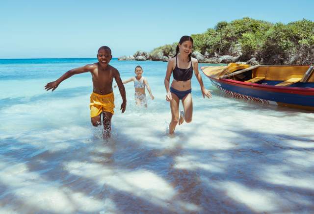 Image of children running on the beach