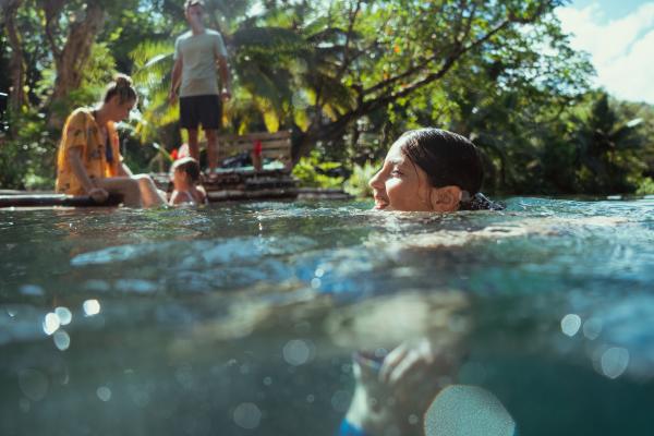 JTB_Adventure_PortAntonio_Mom_Dad_on_Raft_Daughter_In_Water