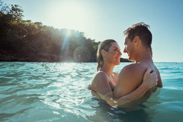 JTB_Romance_Mom_&_Dad_hugging_in_ocean