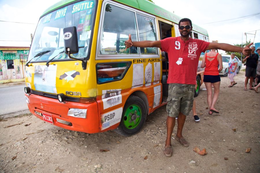 Lenbert Williams, host and driver of the One Love Bus Bar Crawl is all smiles at the first stop on the tour in Negril, Jamaica.